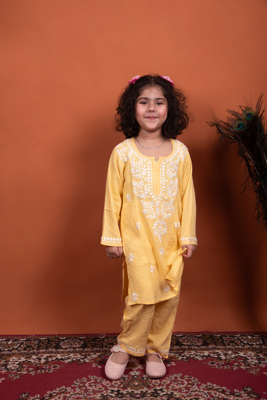 yellow chikankari kidswear dress