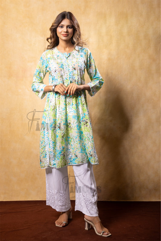 Woman wearing a floral kurta with white pantsagainst a beige background in chikankari work