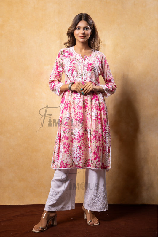 Woman wearing a floral kurta with white pants in chikankari embroidery