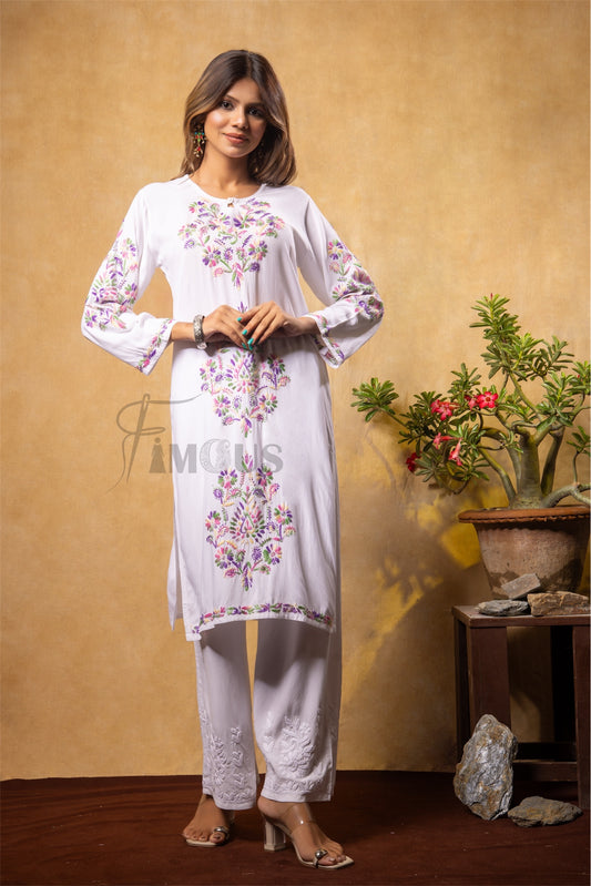Woman wearing a white multy chikankari embroidered outfit 